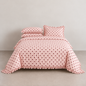 Isla Spot 100% cotton ruffle bedding set in pink with berry-red polka dots