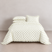 Isla Spot cotton polka dot bedding set in ivory with soft green spots