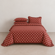 Isla Spot cotton bedding set in cherry red with pale polka dot detailing