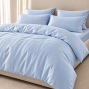 Amélie Bedding Set in Celeste Blue, soft sky tone quilt cover and pillowcases with a smooth lyocell silk sheen