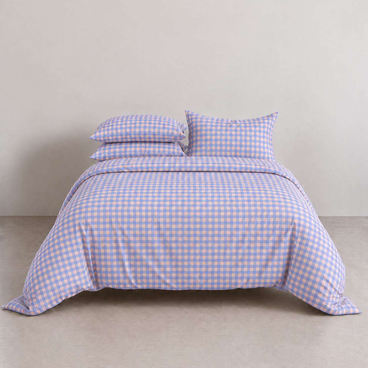 Avery Gingham Bedding Set in Lavender, made bed with periwinkle check quilt cover and stacked pillowcases