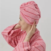 Woman wears the Bambi Striped Bath Robe in Berry Blast - Hair Turban, pink terry with red stripes, matching turban