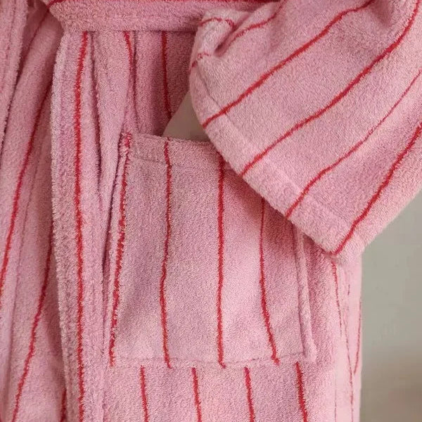 Close-up of Bambi Striped Bath Robe in pink terry cotton with red stripes, showing pocket and cuff detail