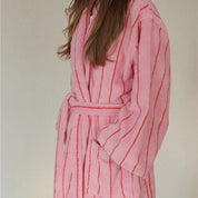 Bambi Striped Bath Robe worn, pink terry cotton with red pinstripes, tied waist, plush texture visible