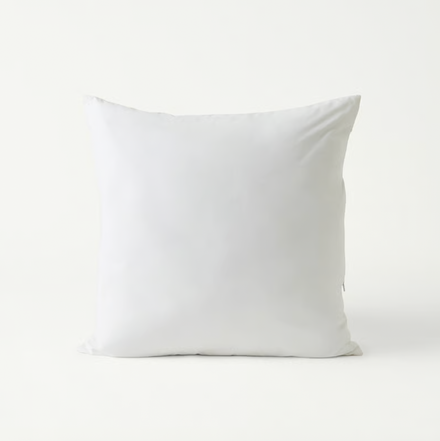 Plain white square cushion insert with plush cotton cover shown against a white backdrop