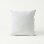 Plain white square cushion insert with plush cotton cover shown against a white backdrop