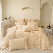 Camellia Ruffle Bedding Set in Champagne Biscuit, ruffled pillowcases and pintuck detail on a made bed