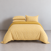 Checkerboard Bedding Set in Lemon, gingham check quilt cover and pillowcases on a made bed
