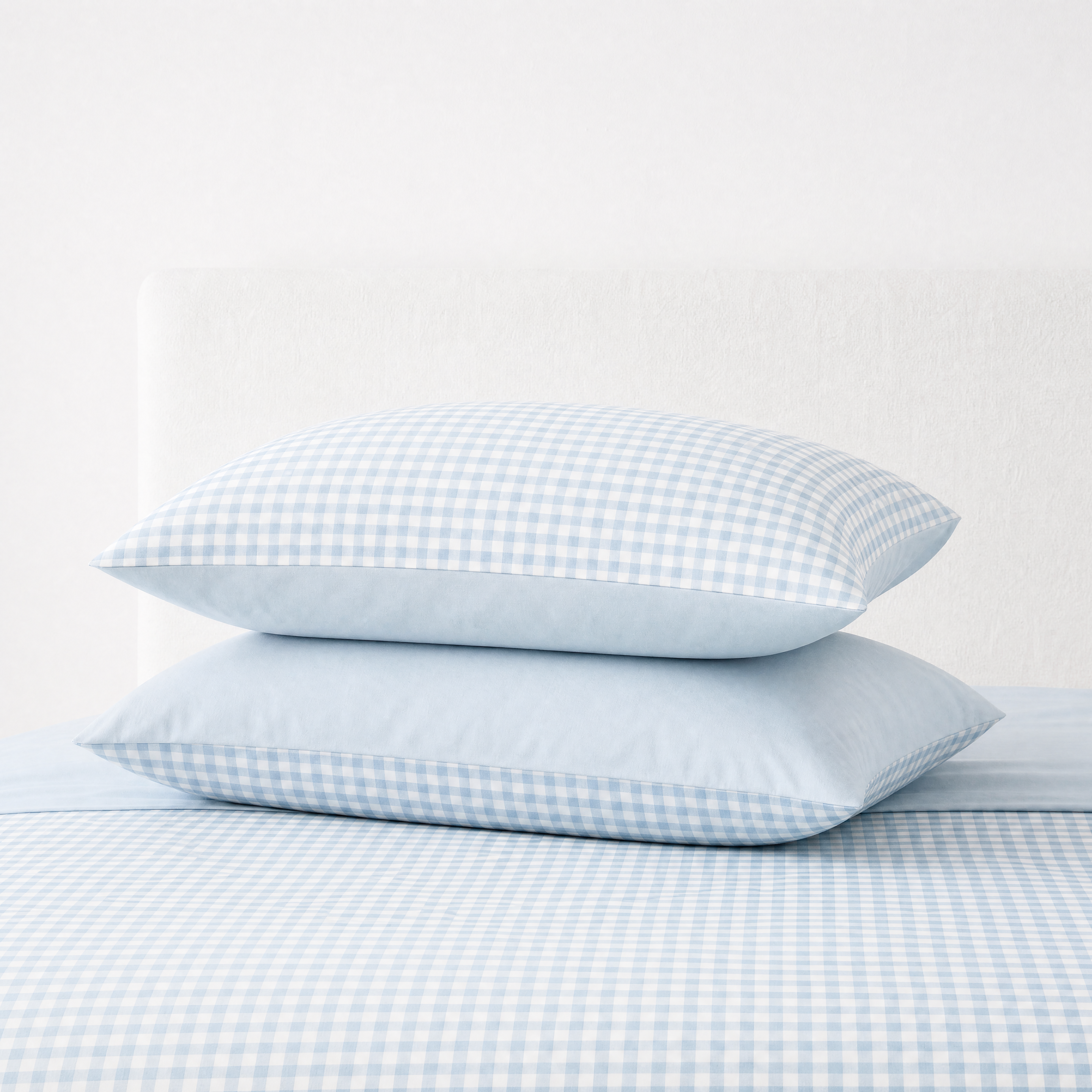 Checkerboard Bedding Set pillowcases in Royal Blue, small check pattern stacked on a matching bed