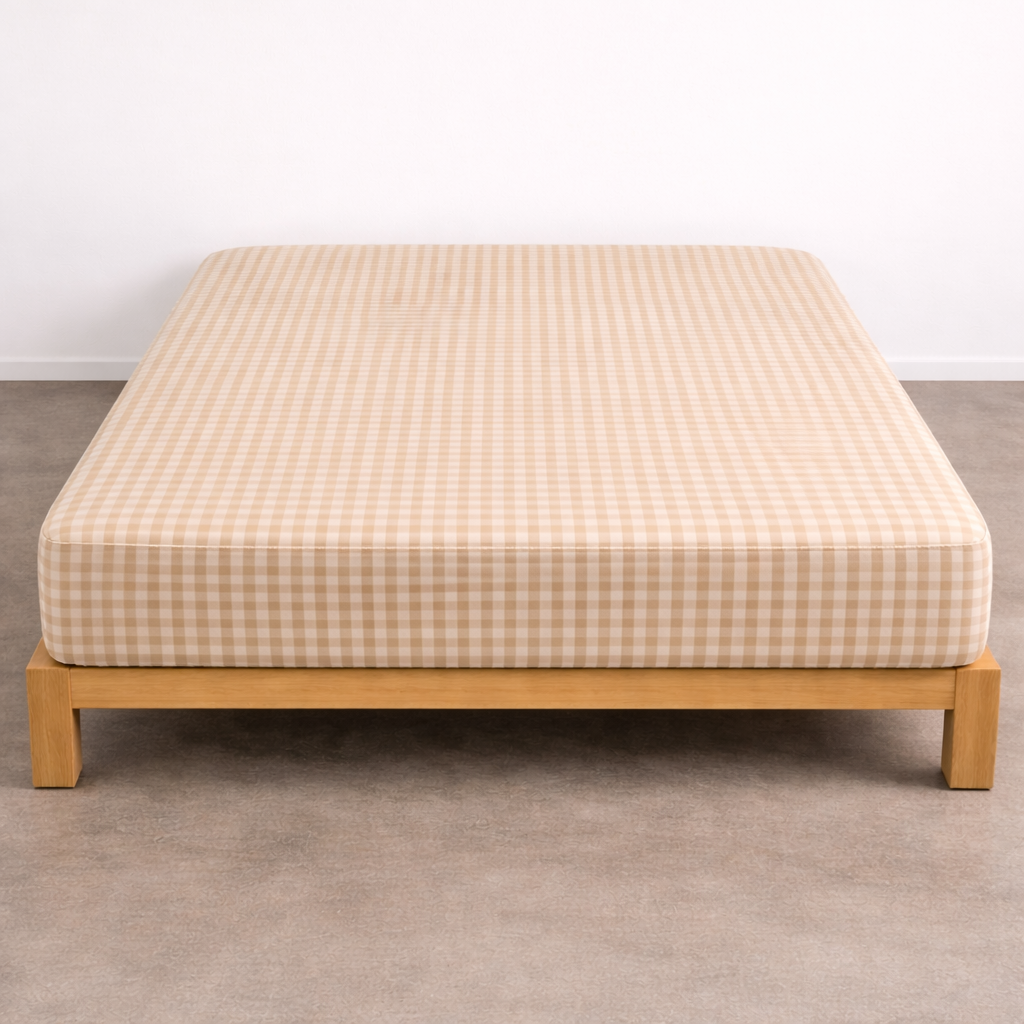 Checkerboard Fitted Sheet in Beige, deep-fit corners over a mattress on a timber bed frame