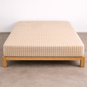 Checkerboard Fitted Sheet in Beige, deep-fit corners over a mattress on a timber bed frame