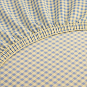 Close-up of the elasticated corner on the Checkerboard Fitted Sheet in Blue & Yellow gingham check