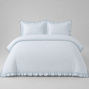 Elsie Spot Bedding Set in Cloud Blue, made bed with scattered spot print and gathered frill edging