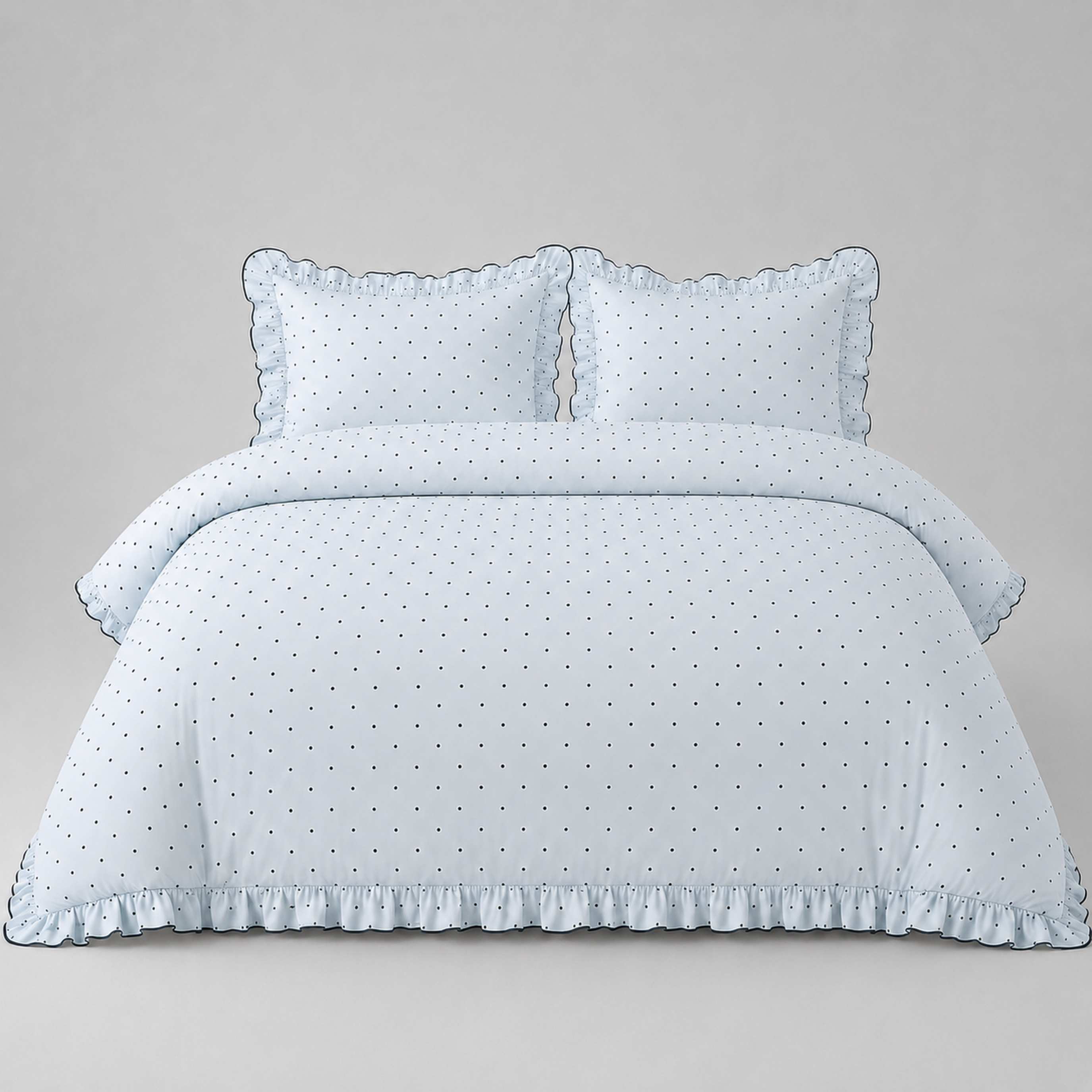 Elsie Spot Bedding Set in Cloud Blue, made bed with scattered spot print and gathered frill edging