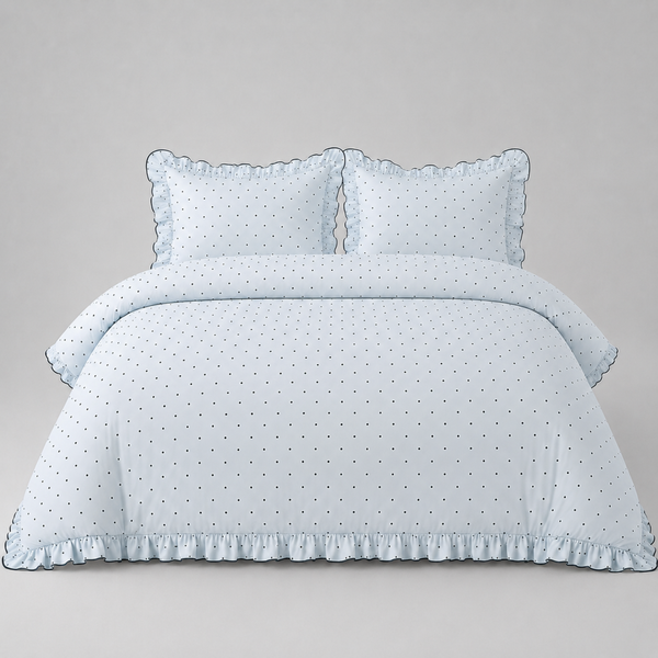 Elsie Spot Bedding Set in Cloud Blue, made bed with scattered spot print and gathered frill edging