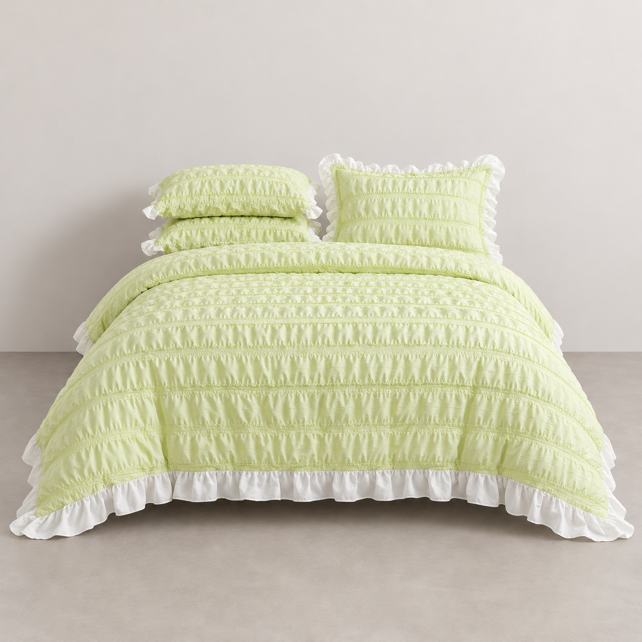 Esmé Ruffle Bedding Set in Lime, made bed with ruched texture and white frill edging