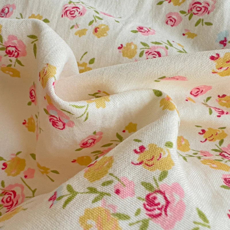 Close-up of Honeybelle Floral Ruffle Bedding Set cotton, pink and yellow roses on cream twill weave