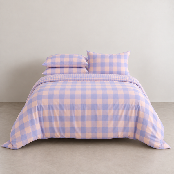 Kyoto Plaid Bedding Set in Lavender Haze, lilac and peach check on a made bed with matching pillowcases