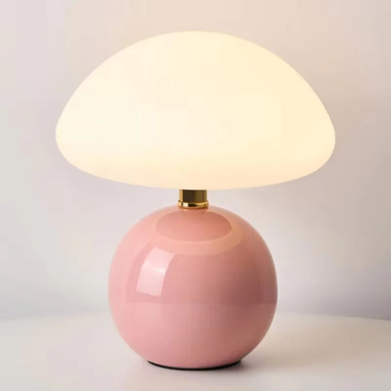 Lumi Mushroom Table Lamp in Blush, glossy pink ball base with domed frosted shade lit warmly