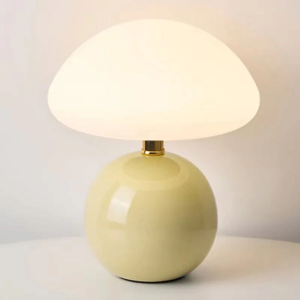Lumi Mushroom Table Lamp in Lime, glossy pale yellow-green base with domed glass shade lit warmly
