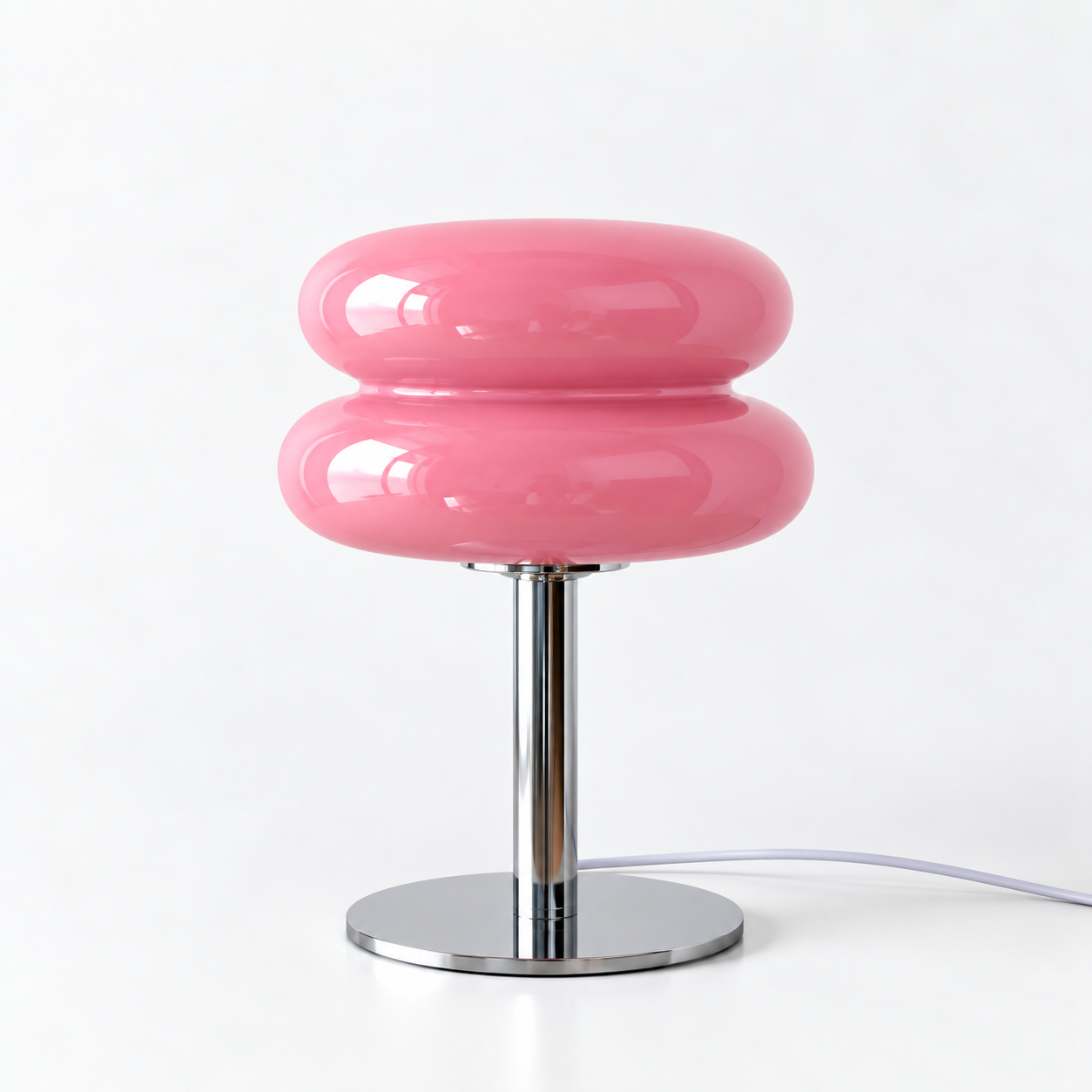 Macaron Lamp in Pink, glossy stacked glass shade on a chrome base against a white backdrop