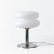 Macaron Lamp in White, glossy stacked glass shade on a chrome base, shown against a plain backdrop