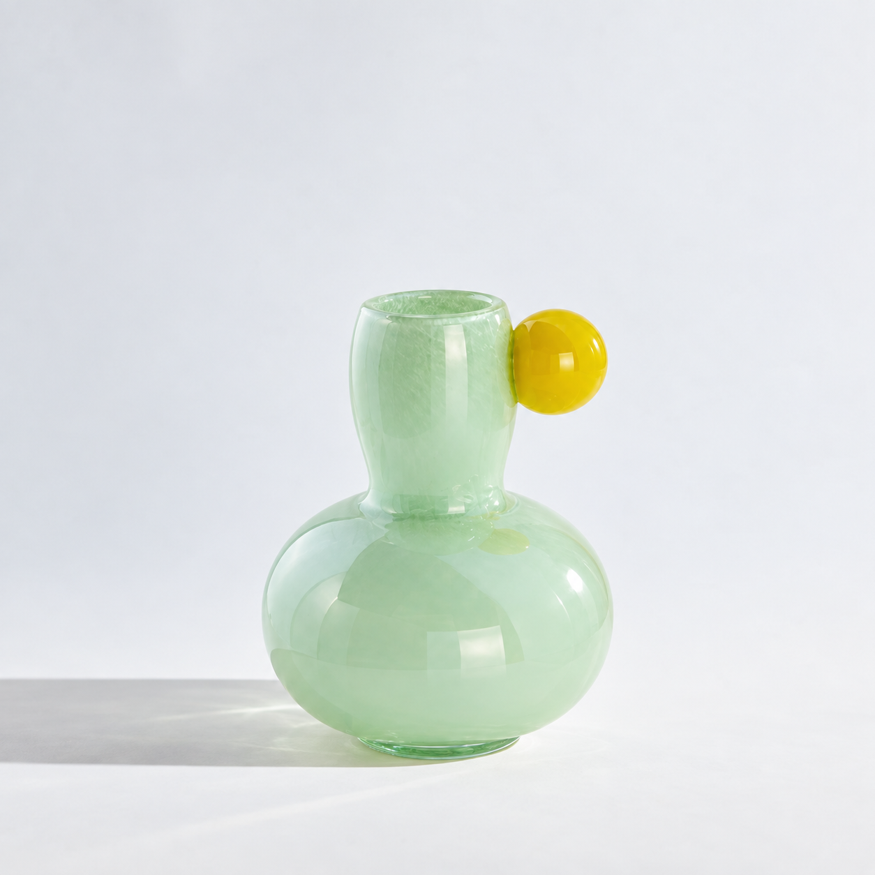 Marley Pastel Vase in Green, gourd shaped glass body with a yellow sphere accent at the neck