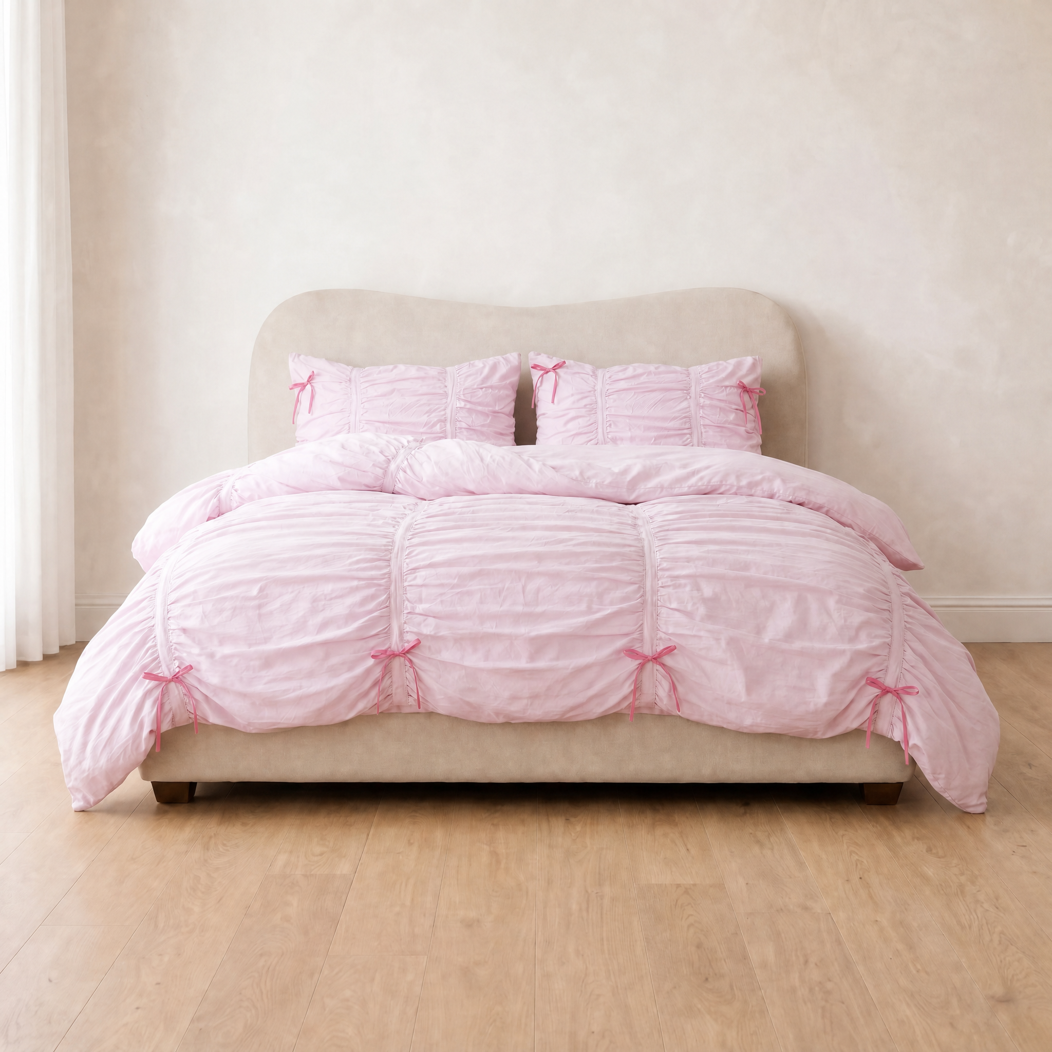 Metaya Bedding Set in Blush Pink, ruched cotton quilt cover with pink bow ties on a made bed