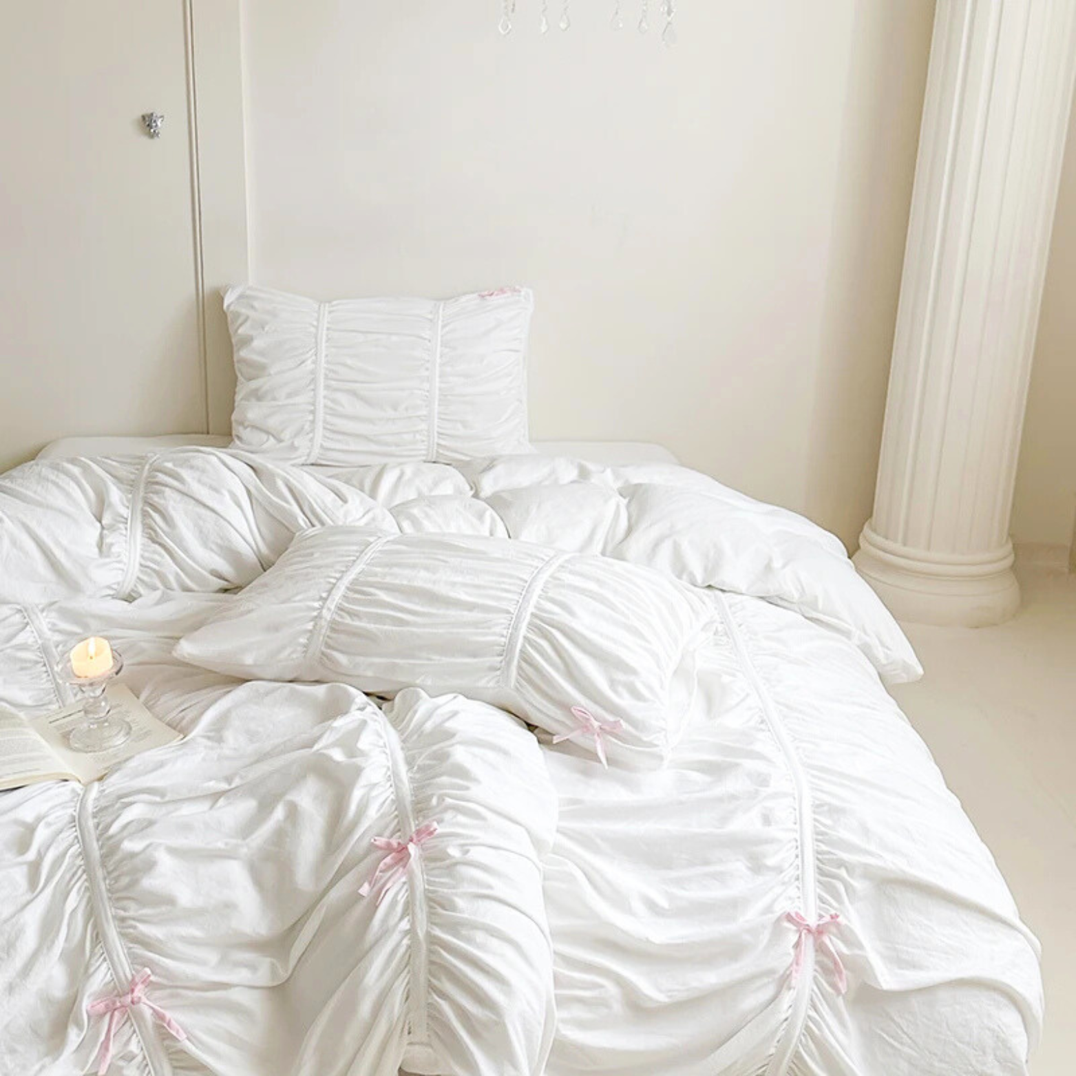 Metaya Bedding Set in Pink & White, ruched quilt cover and pillowcases with pink bow ties on a made bed
