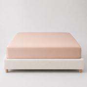 Mira Bamboo Fitted Sheet in Beige, fitted smoothly over a mattress on a boucle bed base