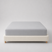 Mira Bamboo Fitted Sheet in Classic Grey, fitted smoothly over a mattress on a boucle bed base