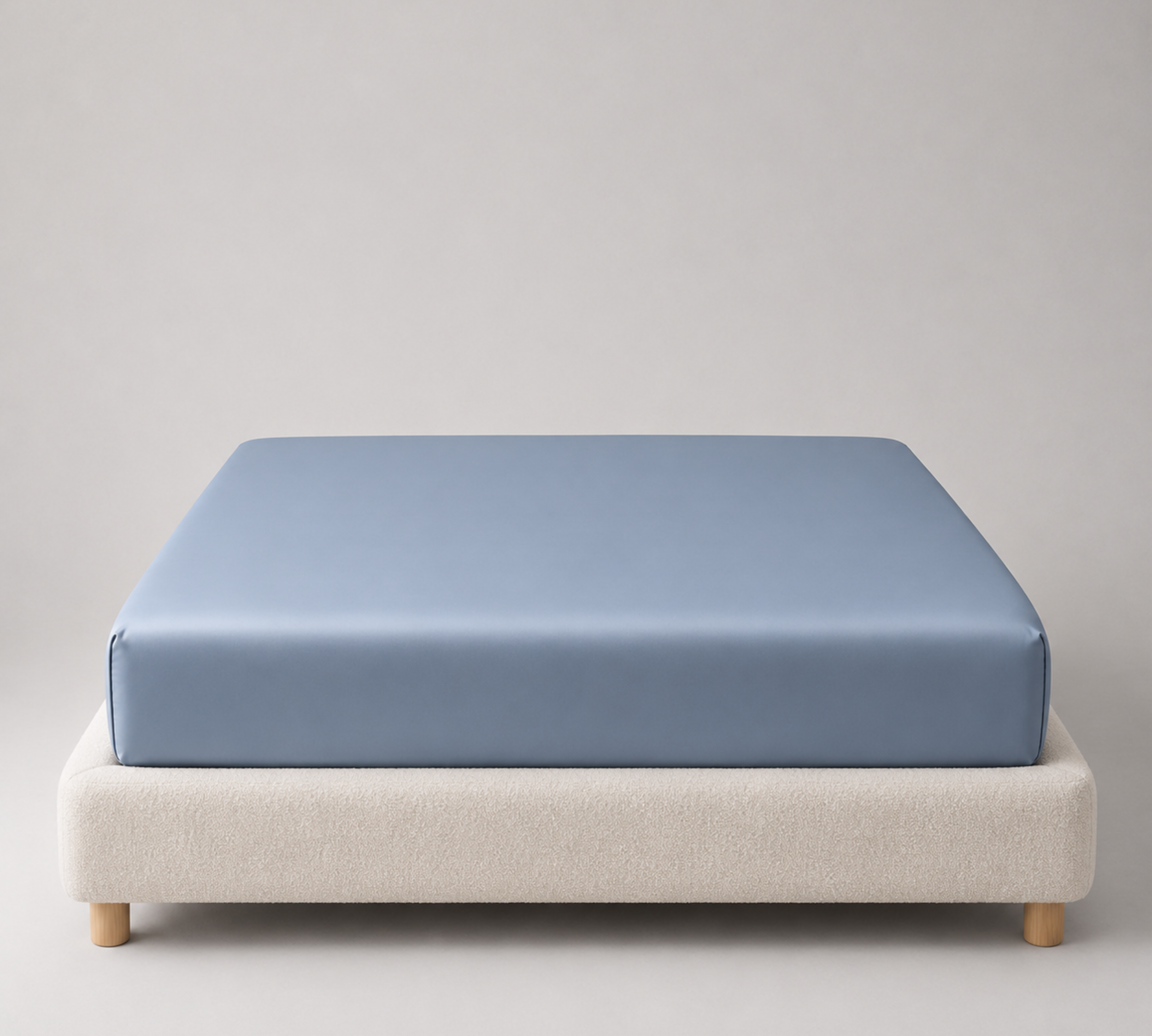 Mira Bamboo Fitted Sheet in Deep Blue, fitted snugly over a mattress with smooth bamboo sheen visible