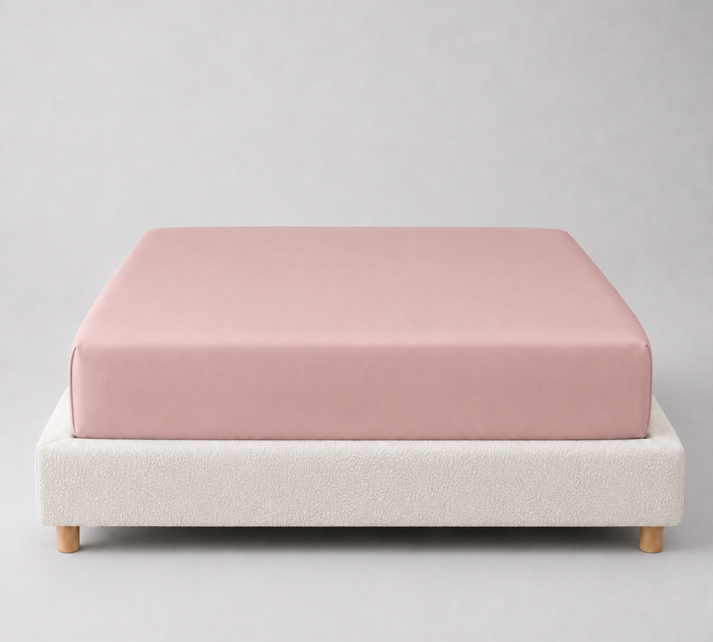 Mira Bamboo Fitted Sheet in Mauve, dusty pink fabric fitted snugly over a mattress base