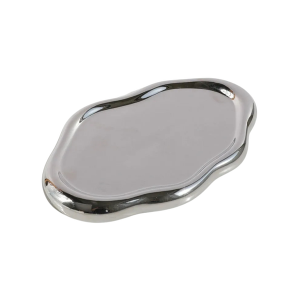 Nola Trinket Tray in Chrome, cloud-shaped with a mirror-polished metallic finish, on a plain background