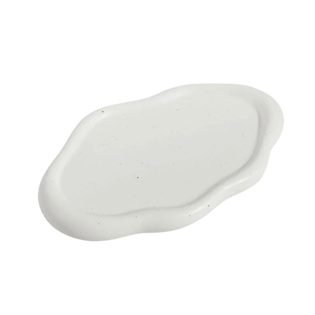 Nola Trinket Tray in Ivory, cloud-shaped ceramic with speckled matte surface, shown on a plain background