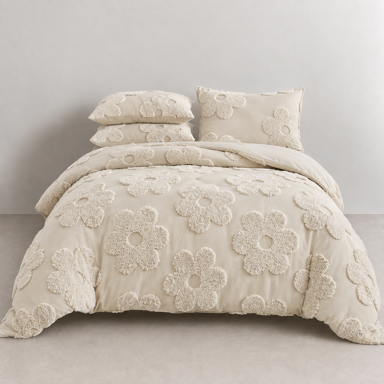 Posie Embroidered Bedding Set on a made bed, tufted cream floral blooms across quilt cover and pillowcases