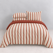 Rhodes Striped Bedding Set in Cherry & Cream, made bed with cream and red striped quilt cover and pillowcases