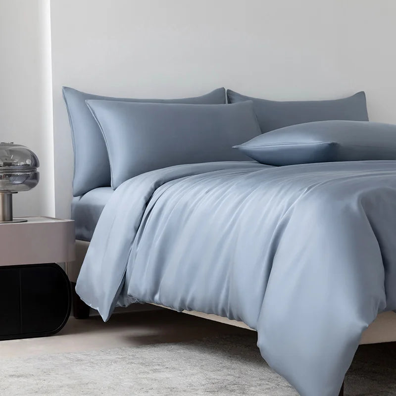 Soléa Bamboo Bedding Set in Deep Sea Blue, sateen quilt cover and pillowcases styled on a made bed