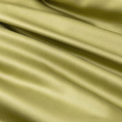 Close-up of the Soléa Bamboo Bedding Set in olive green, sateen weave with soft sheen and draped folds