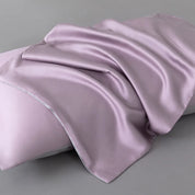 Soléa Bamboo Bedding Set pillowcase in dusty mauve sateen, draped to show its smooth, glossy weave