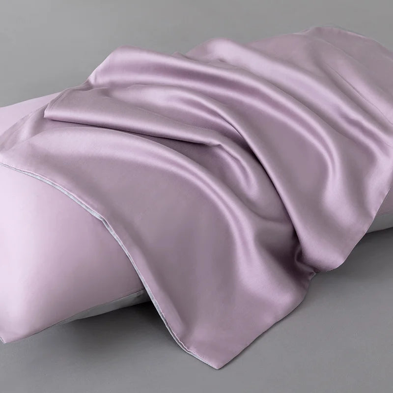 Soléa Bamboo Bedding Set pillowcase in dusty mauve sateen, draped to show its smooth, glossy weave