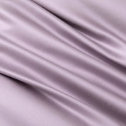 Close-up of the Soléa Bamboo Bedding Set fabric in dusty mauve, showing its smooth sateen sheen and drape