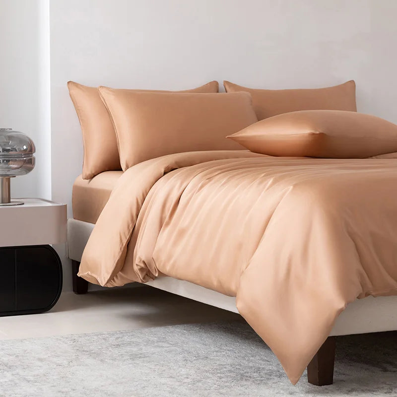 Soléa Bamboo Bedding Set in Rose Gold, sateen quilt cover and pillowcases styled on a made bed