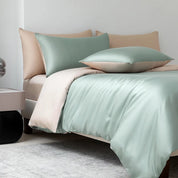 Soléa Bamboo Bedding Set in Spring Green - Gold, sage sateen with beige reverse on a made bed