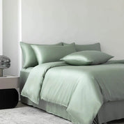 Soléa Bamboo Bedding Set in Spring Green, sateen quilt cover and pillowcases styled on a made bed