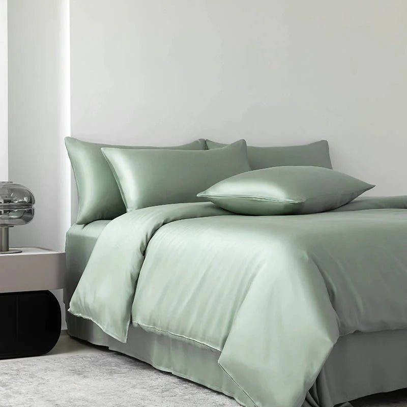 Soléa Bamboo Bedding Set in Spring Green, sateen quilt cover and pillowcases styled on a made bed