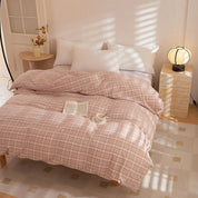Soleil Stripe Bedding Set in Blush Terra, sunlit bedroom with book and teacup on the quilt cover