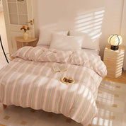 Soleil Stripe Bedding Set in Butter Stripe on a sunlit bed with a book and morning tea tray on top