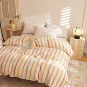 Soleil Stripe Bedding Set in Candy Foam, multicolour stripes on a sunlit made bed with white pillows