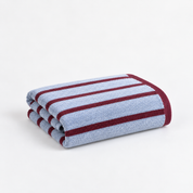 Folded Bath Towel from the Stay Soft™ Neutral Towel Collection in Blue, with contrast burgundy stripe detail